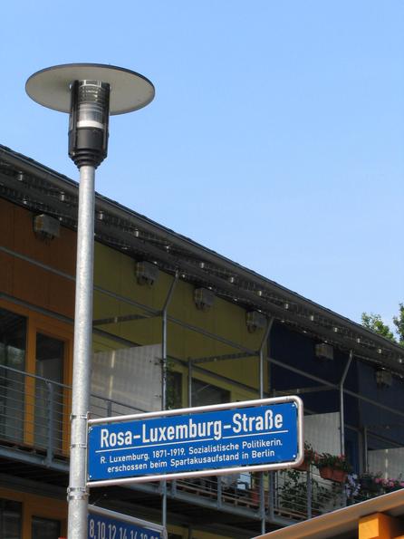 Rosa Luxemburg street in Freiburg
The means of production in the hand of the whole population! The conversion of this ideal is behind the street sign: Photovoltaic roofs for the own production of electric power.
