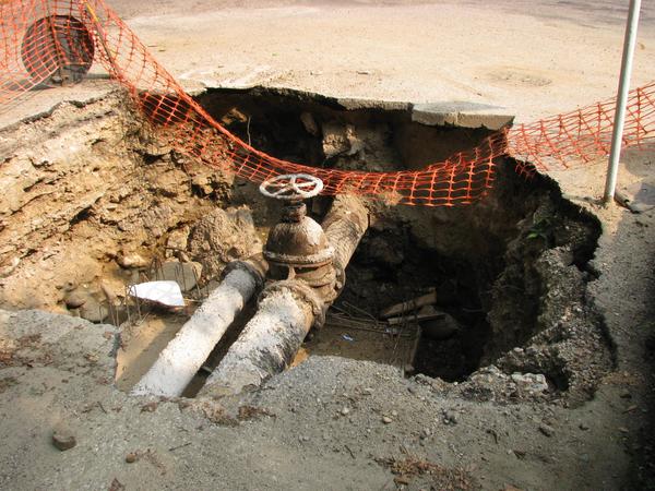 Street Washed Out
Yesterday used, today a hole in the street. Presumably by under washing the street. Material was carreid away by water until the surface collapsed.